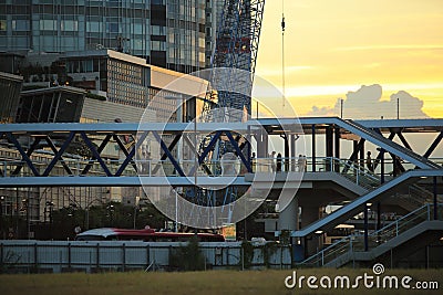 People pass through the busy footbridge Stock Photo