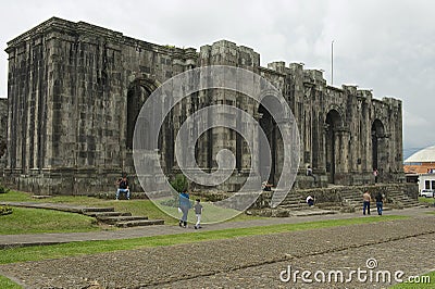 People pass the ruins of the Santiago Apostol cathedral in Cartago, Costa Rica. Editorial Stock Photo