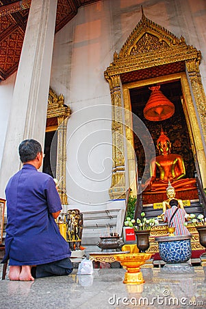 People pay homage, Wat Suthat Thepwararam, Beautiful temple architecture , Bangkok, Thailand Editorial Stock Photo