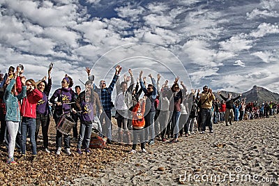 People in a peaceful demonstration on a beach to protect it from construction Editorial Stock Photo