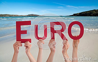 People hands building word euro, ocean and sea Stock Photo