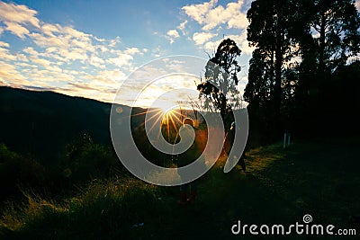 People photographing the sunrise over a mountain view in the Yarra Ranges, Victoria Australia Stock Photo