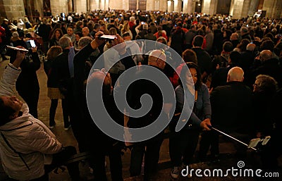 People picture with their mobile phone the 8 of the Palma de Mallorca cathedral Editorial Stock Photo