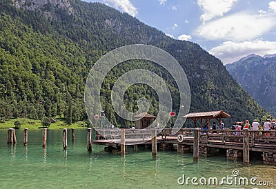 People on pier waiting for launch ship at Konigssee Editorial Stock Photo