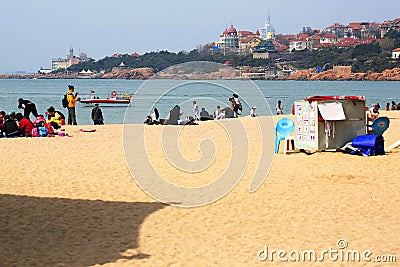 People play on the beach in Qingdao, China Editorial Stock Photo