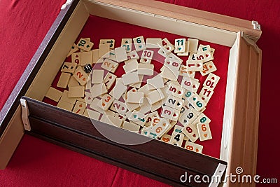 People play popular logic table game rummikub Stock Photo