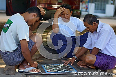 People playing checks in Yangon, Burma, Asia Editorial Stock Photo