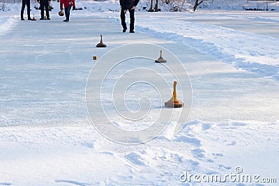 People playing curling on a frozen lake, Austria, Europe Stock Photo