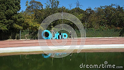 People playing in giant letters forming the word QUITO in the La Carolina Park in the north of the city of Quito Editorial Stock Photo