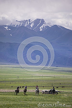 People playing Kok Boru, or dead goat polo, on the plains of Kygyzstan Editorial Stock Photo