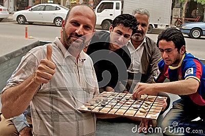 People playing traditional board game, Arbil, Autonomous Kurdistan, Iraq Editorial Stock Photo