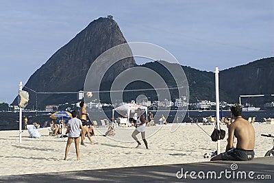 People playing volley-ball on a beach in Rio de Janeiro, Brazil. Editorial Stock Photo