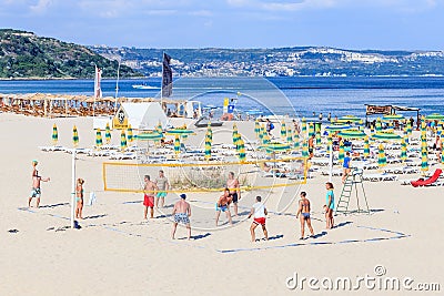 People playing volleyball at beach. Leisure at Black Sea Editorial Stock Photo