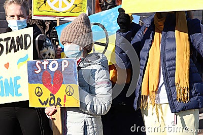 People with posters waiting for the peace protest to start Editorial Stock Photo