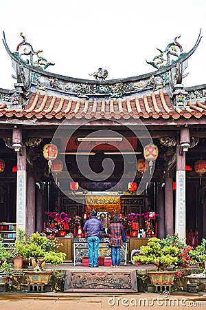 People pray for god in traditional oriental heritage temple in Taiwan Editorial Stock Photo