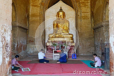 People praying inside the Dhammayangyi Temple in Bagan, Myanmar Editorial Stock Photo