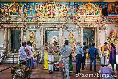 People praying inside Sri Veeramakaliamman Temple in Little India, Singapore Editorial Stock Photo