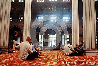 People praying in a Mosque Editorial Stock Photo
