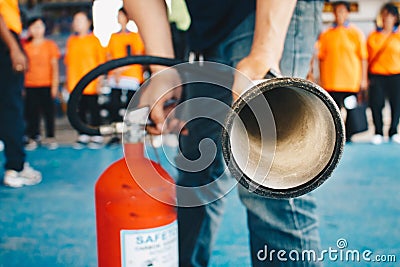 Use a fire extinguisher to fire at the gas tank. Stock Photo