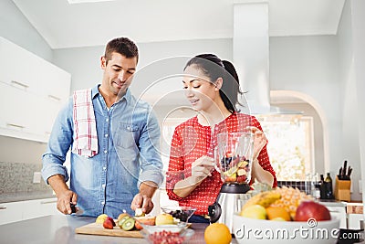 People preparing fruit milkshake Stock Photo