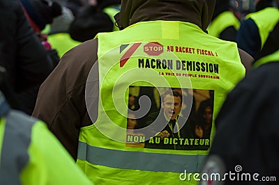 People protesting in the street against taxes and rising fuel prices with picture of Macron president dictator Editorial Stock Photo