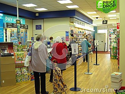 People queuing at a store checkout. Editorial Stock Photo