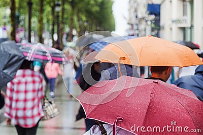 People with rain umbrellas in the rainy city Stock Photo