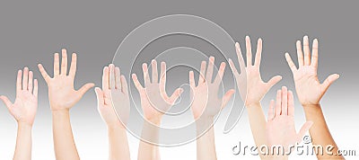 People raising hands for participation, many people`s hands up. teamwork and competition concept Stock Photo