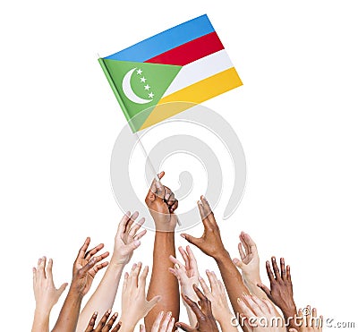 People Reaching For The Flag Of Comoros Stock Photo