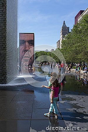 People refreshing at the Crown Fountain, in the Millennium Park in the city of Chicago Editorial Stock Photo