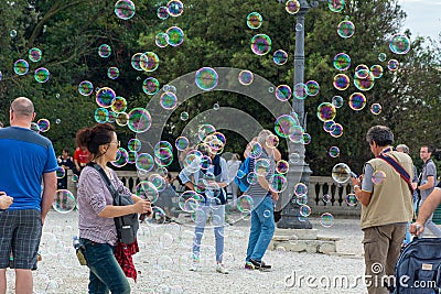 People rejoice in soap bubbles in Rome Editorial Stock Photo