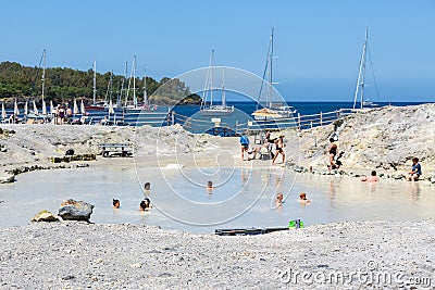 People relaxing in healthy mud pool at Aeolian Islands, Italy Editorial Stock Photo