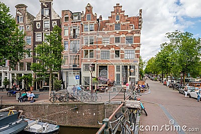 People relaxing on the Prinsengracht, Amsterdam Editorial Stock Photo