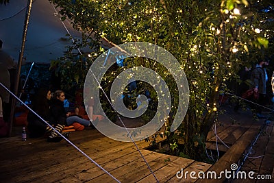 People relaxing in a special chilling natural area decorated wit Editorial Stock Photo