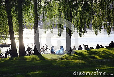 People relaxing by the water in Stockholm Editorial Stock Photo