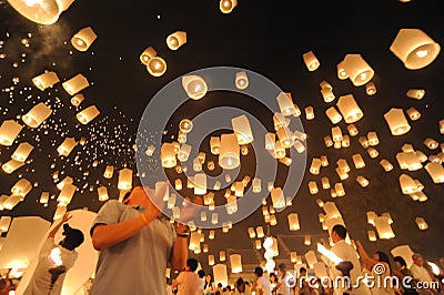 People release Khom Loi, the sky lanterns during Yi Peng or Loi Krathong festival Editorial Stock Photo