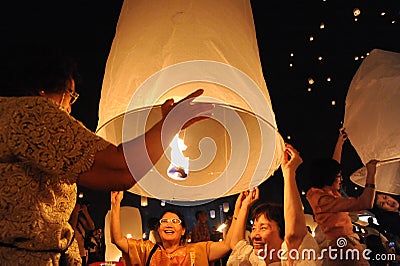 People release Khom Loi, the sky lanterns during Yi Peng or Loi Krathong festival Editorial Stock Photo