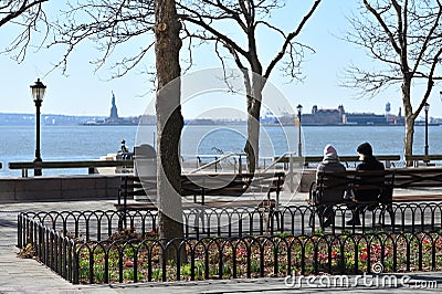 People rest in park at Manhattan waterfront Editorial Stock Photo