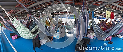 People resting in hammocks on passenger boat deck, Brazil Editorial Stock Photo