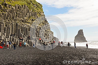 People on Reynisfjara Beach near Vik in Iceland Editorial Stock Photo