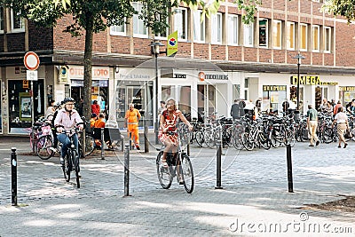 People ride bicycles along the bike path. Everyday city life. Editorial Stock Photo