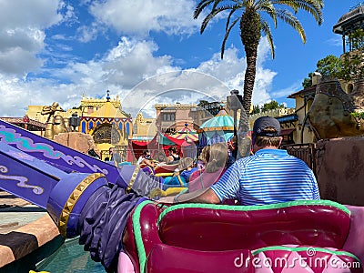 People riding the Aladdin Magic Carpet ride at Disney World Editorial Stock Photo