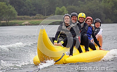 People riding on a banana boat Editorial Stock Photo