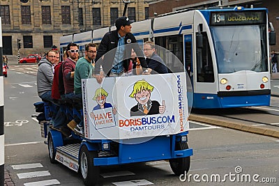 People riding excursion bicycle in Amsterdam, the Netherlands Editorial Stock Photo