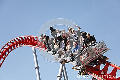 People riding roller coaster Editorial Stock Photo