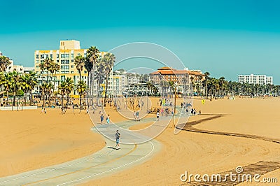 Los Angeles/California/USA - 07.22.2013: People riding on the skate board and bike over bicycle track. Editorial Stock Photo