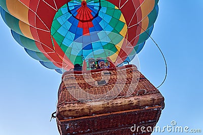 People inflate a huge balloon with a basketpeople rise into the air in the balloon Editorial Stock Photo