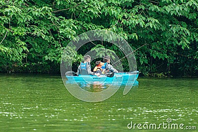 People rowing in West Lake Park Editorial Stock Photo