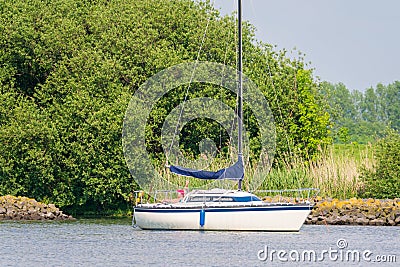 People on sailboat anchored on Spui river, Netherlands Editorial Stock Photo