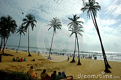 People sat on Goa beach Stock Photo